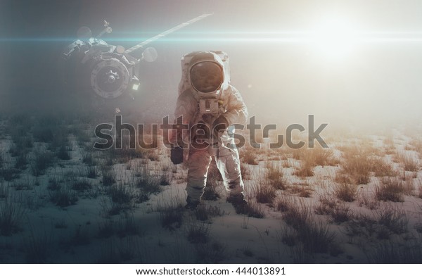 Astronaut walking on an unexplored planet. Elements\
furnished by NASA
