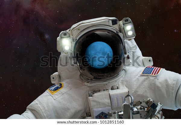 An astronaut watching\
Super Moon in space - Lunar eclipse \