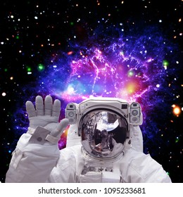 Astronaut waves. The elements of this image furnished by NASA.
