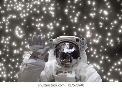 Astronaut waves. Stars. The elements of this image furnished by NASA.