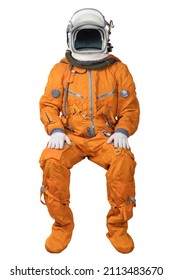 Astronaut Wearing An Orange Spacesuit And Open Space Helmet Sitting Isolated On White Background. Unrecognizable Cosmonaut Isolated On White Background