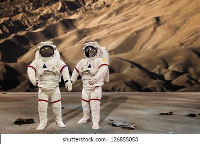 Astronaut Wearing Pressure Suit in a sand dune Background