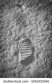 Astronaut's Boot Print On Lunar Moon Landing Mission. Moon Surface. Image Of The Moon Showing Landing Site Of Apollo 11. Elements Of This Image Furnished By NASA