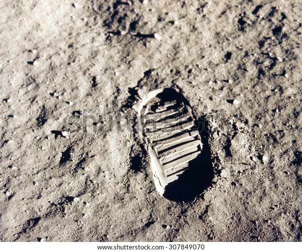 Astronaut\'s boot print on lunar (moon)\
landing mission. Elements of this image furnished by\
NASA.
