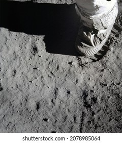 An Astronaut's Stepping On The Moon (lunar) Surface And Leaving A Boot Print. Elements Of This Image Furnished By NASA.