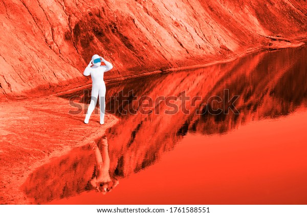 Astronauts woman wear helmet observe planet Mars\
and red lake. female Astronaut on the Moon with reflection in water\
-  image for NASA. lunar craters. planet Earth after environmental\
disaster