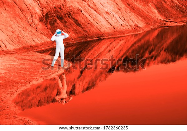 Astronauts woman wear helmet observe planet Mars\
and red lake. female Astronaut on the Moon with reflection in water\
-  image. lunar craters. planet Earth after environmental\
disaster