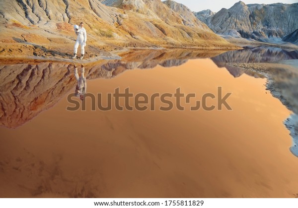 Astronauts woman without helmet observe planet\
Mars and red lake. female Astronaut on the Moon with reflection in\
water -  image for NASA. lunar craters. planet Earth after\
environmental\
disaster