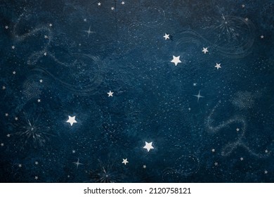Astronomical Celestial pattern Constellation Pisces from star shape silver confetti on the blue background