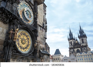 Astronomical clock of in Old Town of Prague with Tyn church at the background 