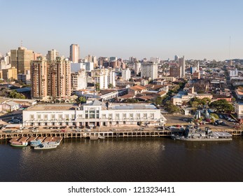 ASUNCION, PARAGUAY - July 13, 2018: Panoramic view of skyscrapers skyline of Latin American capital of Ciudad de Asunción Paraguay and Embankment of Paraguay river as seen in aerial drone photo.