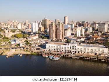 ASUNCION, PARAGUAY - July 13, 2018: Panoramic view of skyscrapers skyline of Latin American capital of Ciudad de Asunción Paraguay and Embankment of Paraguay river as seen in aerial drone photo.