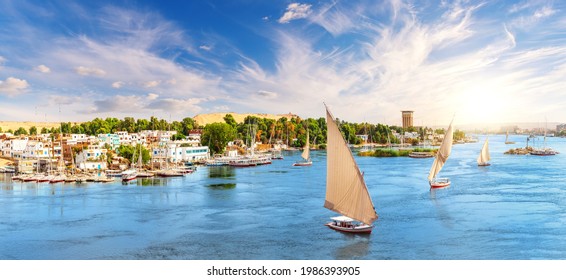 Aswan City In Egypt, Beautiful Scenery Of The Nile River With Felucca Boats