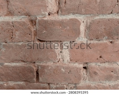 asymmetrical arrangement of red bricks 