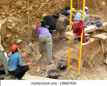 ATAPUERCA, SPAIN - AUGUST 5: Some researchers work in Atapuerca site, where fossils and stone tools of the earliest known humans in West Europe have been found, on August 5, 2005, in Atapuerca, Spain.