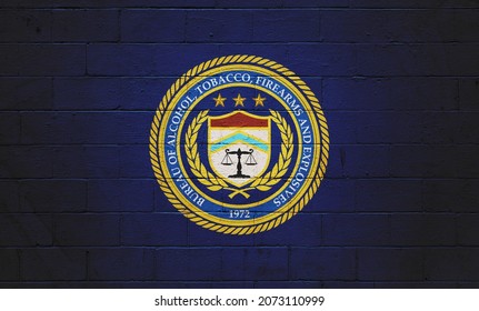 The ATF (Bureau of Alcohol, Tobacco, Firearms and explosives) painted on a brick wall. - Shutterstock ID 2073110999