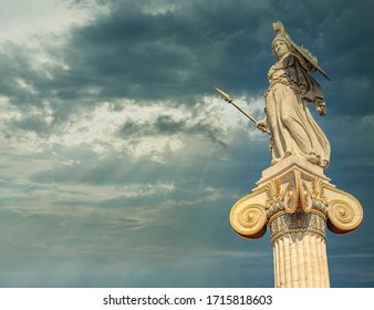 Athena the ancient Greek goddess of wisdom and knowledge statue under dramatic sky, Athens Greece