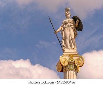 Athena marble statue on Ionic column and partly cloudy sky, space for text