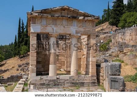 Athenian Treasury in Delphi, an archaeological site in Greece, at the Mount Parnassus. Delphi is famous by the oracle at the sanctuary dedicated to Apollo. UNESCO World heritage