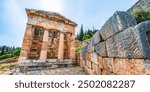 Athenian Treasury,. Delphi with ruins of the Temple of the ancient Sanctuary of Apollo in Delphi, Greece, at the Mount Parnassus