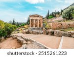 Athenian Treasury,. Delphi with ruins of the Temple of the ancient Sanctuary of Apollo in Delphi, Greece, at the Mount Parnassus