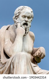 ATHENS, ATTICA ,GREECE - 7 of August 2020 : Close up of the marble statue of the ancient Greek philosopher Socrates in front of National Academy of Athens. Cloudy day