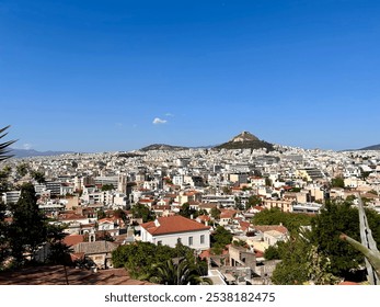 Athens city high angle view with Lycabettus hill in a sunny day. - Powered by Shutterstock