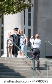 ATHENS, GA - MAY 13:  A Male College Graduate Poses With Family Members For A Photo Before The Graduation Ceremony At The University Of Georgia On May 13, 2016 In Athens, GA.