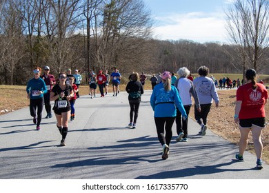 Athens, Georgia - January 1, 2020: Runners And Walkers Pass Each Other During The New Years At Noon 5k Road Race.