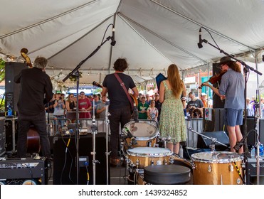 Athens, Georgia - June 22, 2019: Acoustic Act, The Moonshine, Plays Under A Tent On One Of Three Open-air Stages During The Three-day AthFest Music And Arts Festival.