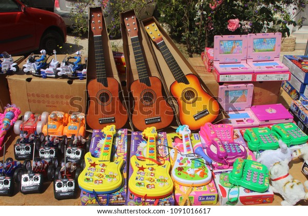 Athens / Greece - 05/01/2018: Plastic toys\
made in China for sale at a street\
market