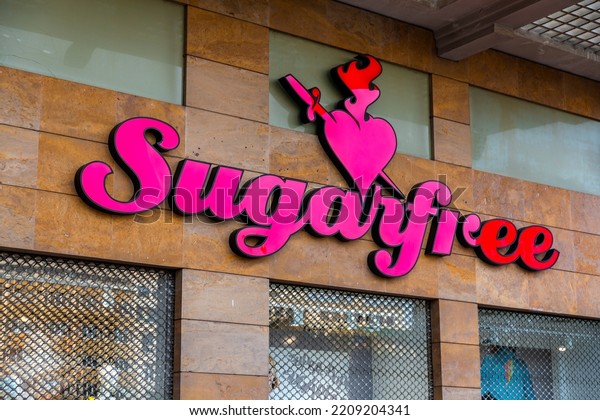 Athens, Greece - 27 Nov 2021: Store\
front and logo of Sugarfree, a Greek apparel\
company.