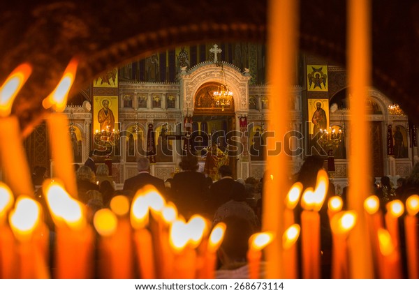 ATHENS, GREECE - APR 12, 2015: Unknown people\
during celebration of Orthodox Easter (Midnight Office of Pascha)\
Holy Saturday is often the only time that the Midnight Office will\
be read in parishes.