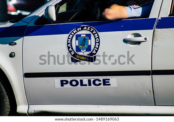 Athens Greece August\
27, 2019 View of a Greek police car driving through the streets of\
Athens in the morning