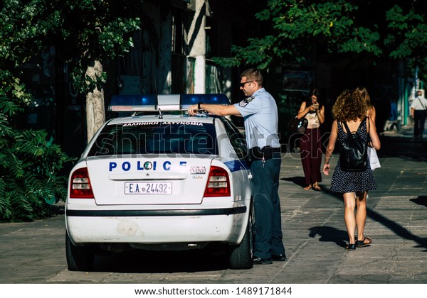 Athens Greece August 27,\
2019 View of a Greek police officer in the streets of Athens in the\
morning