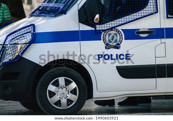 Athens Greece\
August 28, 2019 View of a Greek police car parked front the entry\
of Acropolis of Athens in the\
morning