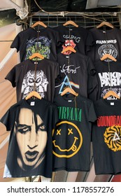 ATHENS, GREECE - AUGUST 29, 2018: T-shirts Printed With Rock Band Designs. Pop Music Merchandise.