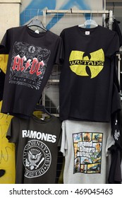 ATHENS, GREECE - AUGUST 4, 2016: Rock And Hip Hop Music T-shirts For Sale Printed With Band Logos By The Ramones, AC/DC, Wu-Tang Clan And Video Game Grand Theft Auto.