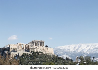 Athens, Greece - February 17 2021: Acropolis View In Winter, With Snow In The Mountains