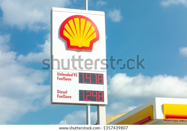 ATHENS, GREECE\
- FEBRUARY 9, 2019: Shell gas station banner with a company logo\
andfuels provided with their\
prices.