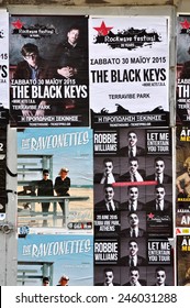 ATHENS, GREECE - JANUARY 16, 2015: City Wall Covered With Concert Posters For Upcoming Live Music Shows By The Black Keys, Raveonettes And Robbie Williams.