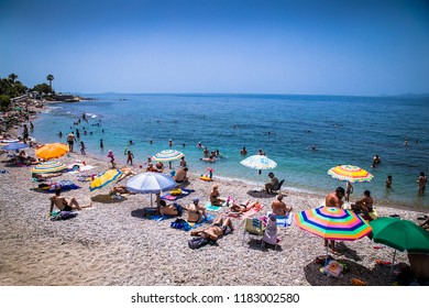 ATHENS, GREECE - JUNE 19, 2016: People On The Beach In Palaio Faliro In Athens, Greece .