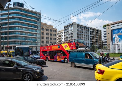 ATHENS, GREECE - MAY 14, 2022: Group of tourists, taking a tour on the open-top double-decker bus Omonia Square