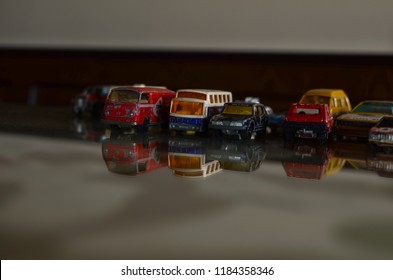 Athens, Greece – May 29, 2015: Old Matchbox Toy Cars Of The 70’s, Parked On A Crystal Glass Table