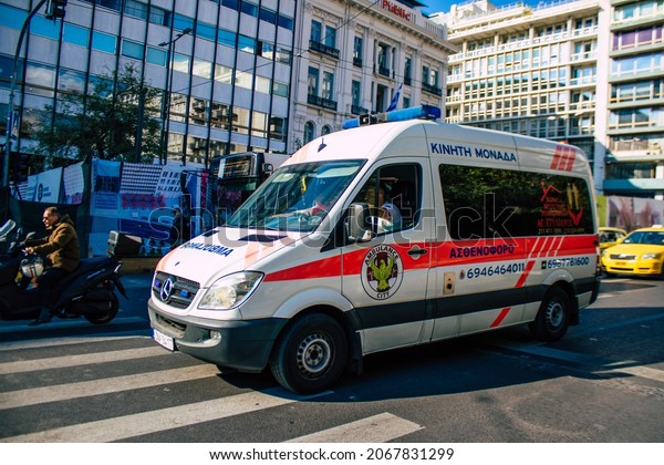Athens, Greece - November 01, 2021 Greek ambulance\
driving through the streets of Athens during the coronavirus\
outbreak hitting Greece