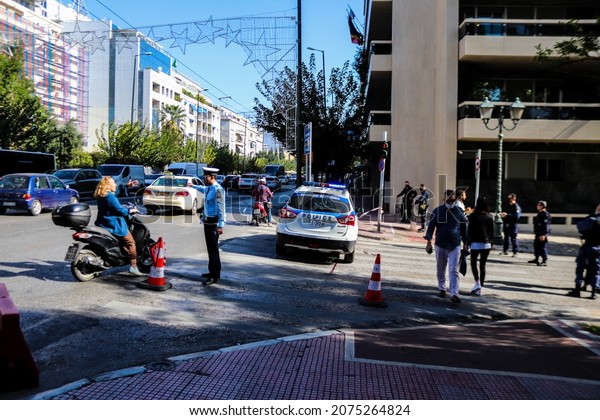 Athens, Greece - November 06, 2021 Greek police on\
patrol in the city center of Athens during the coronavirus epidemic\
hitting Greece