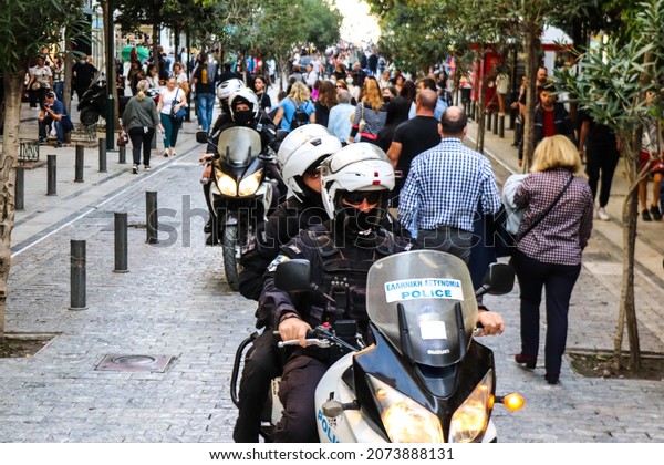 Athens, Greece - November 07, 2021 Greek police on\
patrol in the city center of Athens during the coronavirus epidemic\
hitting Greece