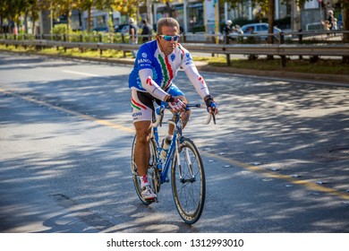 ATHENS, GREECE - NOVEMBER 10, 2013: 	 Cyclist Following Runners At The 31st Athens Classic Marathon (The Authentic).