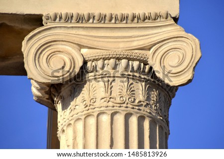 ATHENS, GREECE – NOVEMBER 4, 2018: A column capital in the Ionic order on the ancient Greek temple of Erechtheion which was built on Acropolis in the 5th century BC, dedicated to Athena and Poseidon.