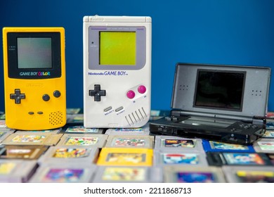 Athens Greece October 1 2022. Handheld Game Consoles, Game Boy, Game Boy Color And DS Lite With Some Cartridges On A Blue Dark Background